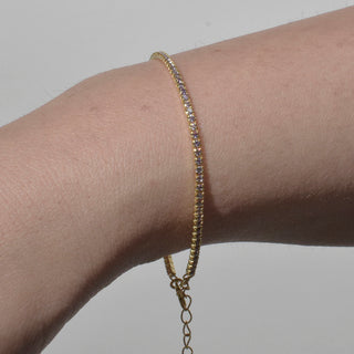 PULSERA ARECA DORADA MORADA